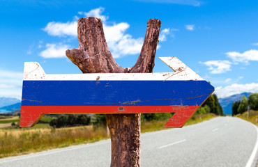 Russia Flag wooden sign with road background