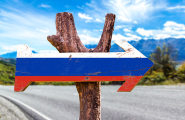 Russia Flag wooden sign with road background