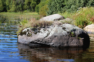 Fototapeta na wymiar landscape stone on the lake