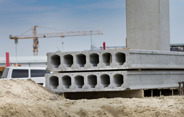 Concrete prefabricated slabs left on ground at building site