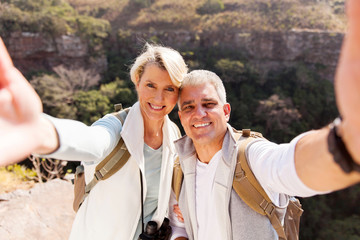hiking couple taking selfie together