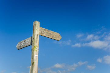 Wooden Footpath Sign and Blue Sky