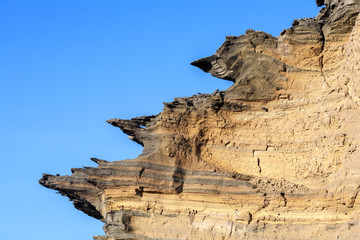 volcanic stone formation with blue sky at el Golfo