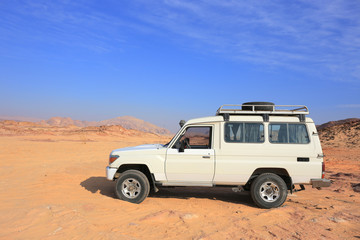 Fototapeta na wymiar off road Safari Jeep in the desert