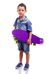 Schoolboy standing with a skateboard and backpack on white backg © cristovao31