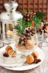 Walnuts, pine cone, and cinnamon, Christmas decoration, holiday season, selective focus