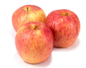 Wet red apples and water drops on  white background with clippin