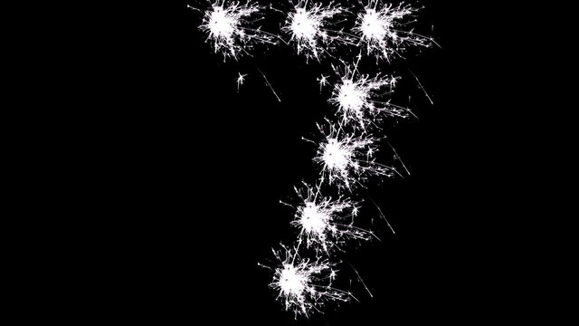 Number 7 in white sparklers on black background.