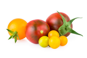 red and yellow tomatoes isolated on white