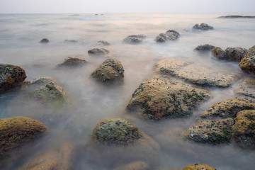Rock in the sea and the soft waves