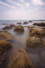 Rock in the sea and the soft waves