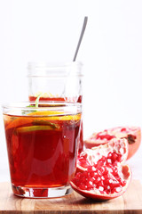 glass of pomegranate juice with fresh fruits