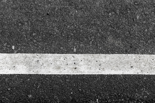 Asphalt road texture with white line