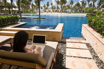 Using computer at hotel lagoon room