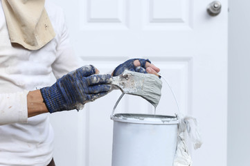 Painter hand holding paint brush