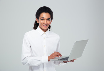 Afro american businessman using laptop