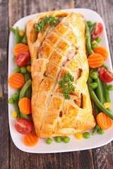 pork fillet cooked with dough crust and vegetable