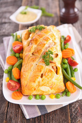 pork fillet cooked with dough crust and vegetable