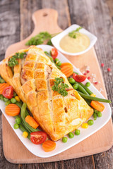 pork fillet cooked with dough crust and vegetable