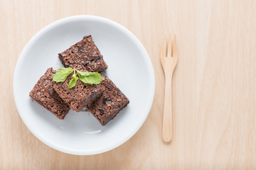 Brownie on wood background, Top view.