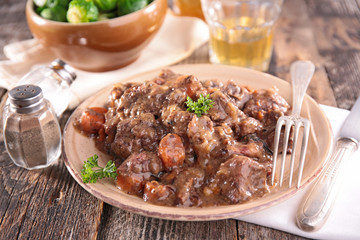 meat cooked with wine sauce and vegetable