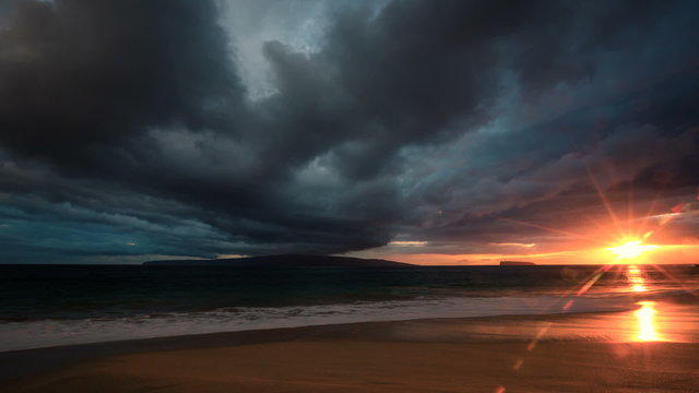 Perfect Time Lapse Sunset. Dramatic Storm Clouds over Ocean Sunset in Hawaiian Islands.