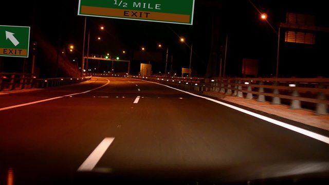 Driving on Highway/interstate at night,  Exit sign of the London, United Kingdom