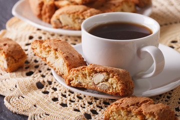 Black coffee and Italian cookies cantuccini macro. Horizontal
