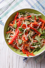 salad with sprouts, peppers and sesame closeup. Vertical top view
