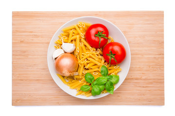 Wooden cutting board with a plate of ingredients on it