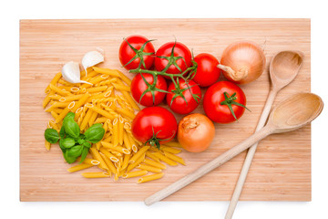 Wooden cutting board with italian ingredients on it