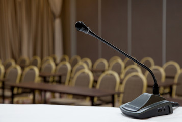 Black microphone in concert hall or conference room photo