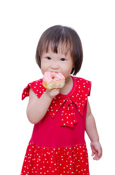 Little Asian Girl Eating Donut Over White