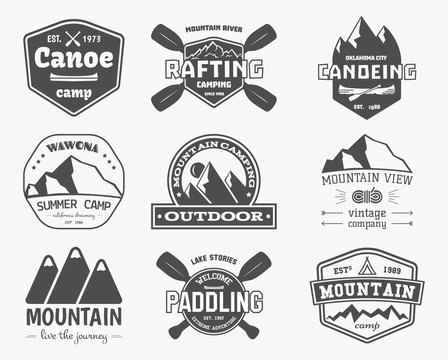 Set of vintage mountain, kayaking, paddling, canoeing camp logo
