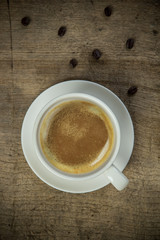 Hot coffee on the wooden table in the morning