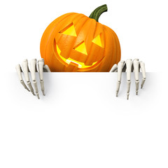 Halloween - illuminated carved pumpkin with skeletal hands holding blank board from above