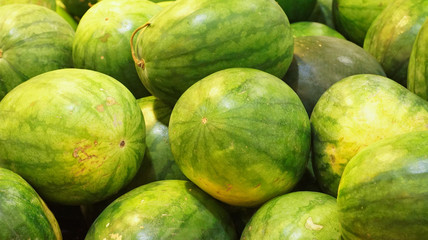 Watermelon fruits with selective focus and shallow depth of field.