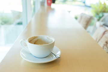 hot of coffee drink on wooden table bar in the cafe