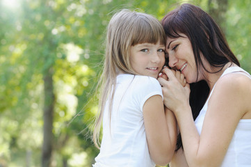 Naklejka premium tender touch of cute girl and her mother