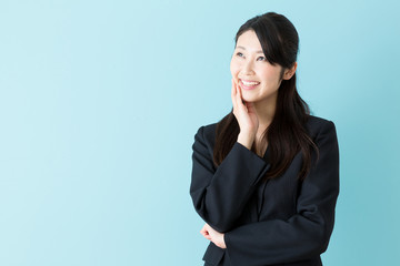 portrait of asian businesswoman on blue background