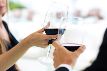 Couple drinking wine in restaurant