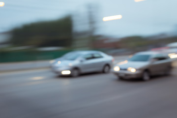car driving on road with traffic jam in the city, abstract blurred