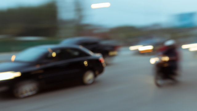 Car And Motorcycle Driving On Road With Traffic Jam In The City, Abstract Blurred