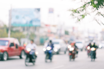 car and motorcycle driving on road with traffic jam in the city, abstract blurred