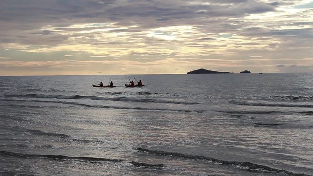 Prachuap Khiri Khan, Thailand-August 23,2015: Unidentified travelers are paddle boat in the sea