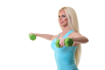 Fototapeta na wymiar beautiful sporty woman working out with dumbbells