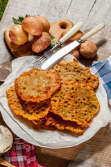 Potato pancake on a wooden table.