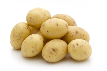Potatoes on the white background.  New harvest.