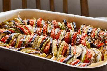 freshly baked mixture of satay and ratatouille in a cooking form