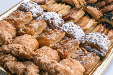 Sweet pastry, puff pastry with powdered sugar, with pine nuts,  with jam made from Siam pumpkin, puff pastry with roasted apples and  with baked apples.